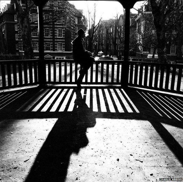 Black and white photo of man on bandstand