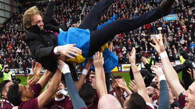 Hearts manager Robbie Neilson is lifted about his Championship-winning players