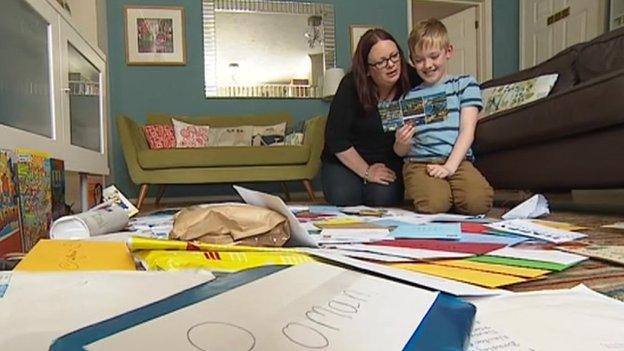 Roman with his cards and presents
