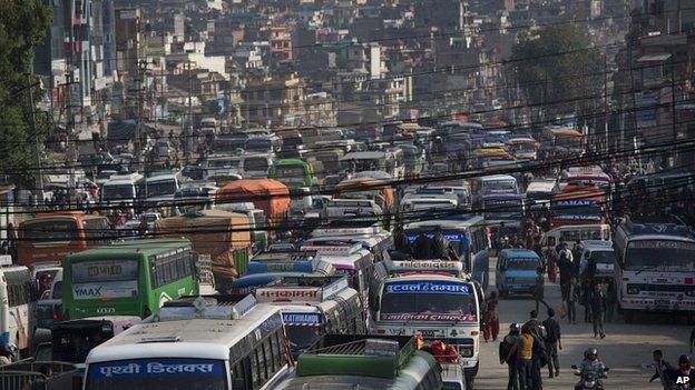 Buses loaded with people going to their home towns prepare to leave Kathmandu. 29, April 2015