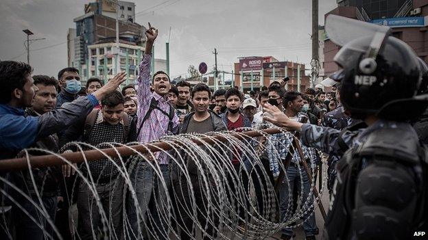 Riot police face angry crowd in Kathmandu. 29 Apr 2015