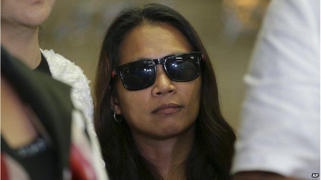 Maria Kristina Sergio, the alleged recruiter of convicted Filipino drug trafficker Mary Jane Veloso who allegedly gave her the bag that contained the heroin found by police at Yogyakarta airport in Indonesia, stands as Philippine Justice Secretary Leila De Lima, left, answers questions from reporters during a press conference at Camp Crame police headquarters in suburban Quezon city, north of Manila, Philippines Wednesday, 29 April 2015.