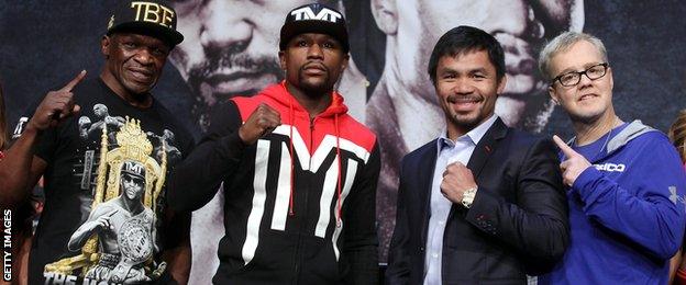 Floyd Mayweather Sr., WBC/WBA welterweight champion Floyd Mayweather Jr., WBO welterweight champion Manny Pacquiao and trainer Freddie Roach pose during a news conference