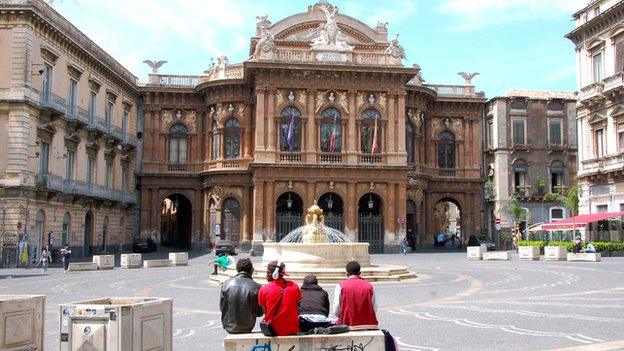 A group of African migrants outside the Teatro Massimo Bellini, Catania - April 2015