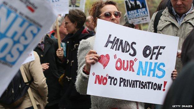 A woman protests against NHS privatisation in London in May 2013