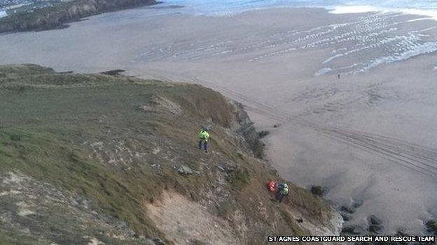 St Agnes Coastguard Search and Rescue Team putting the dog into their rescue bag