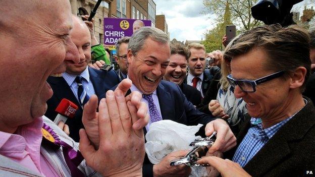 Nigel Farage receives a gift from a French sculptor, while campaigning in Aylesbury, Buckinghamshire