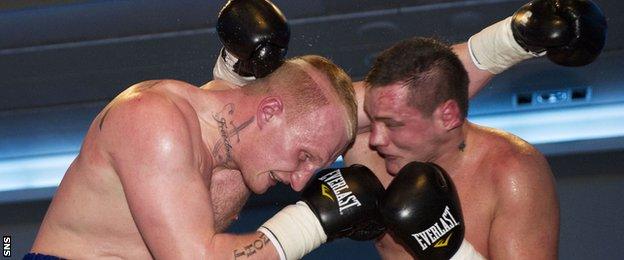 Gary Cornish (left) clashes with opponent Tamas Bajzath in January