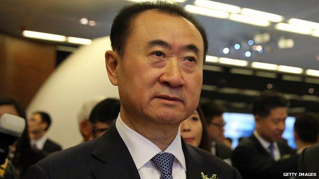 Wang Jianlin arrives at the Hong Kong stock exchange on 23 December, 2014