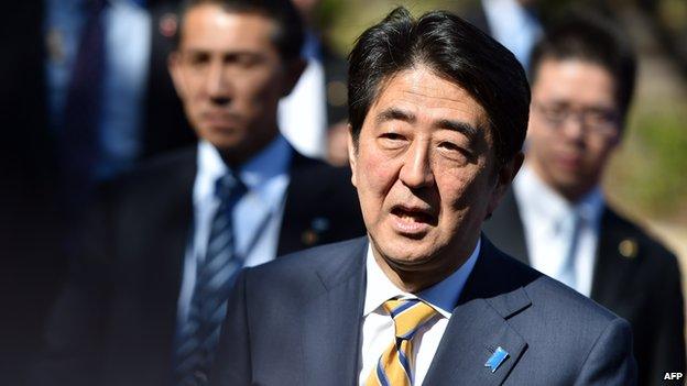 Japan's Shinzo Abe speaks to members of the media at Tesla's headquarters in Palo Alto, California on 30 April, 2015