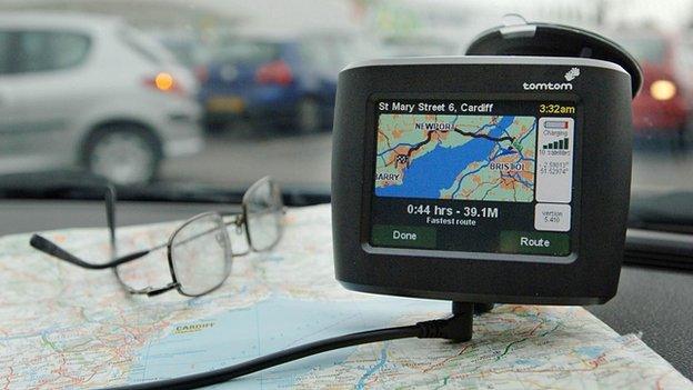 Sat nav and map on car dashboard