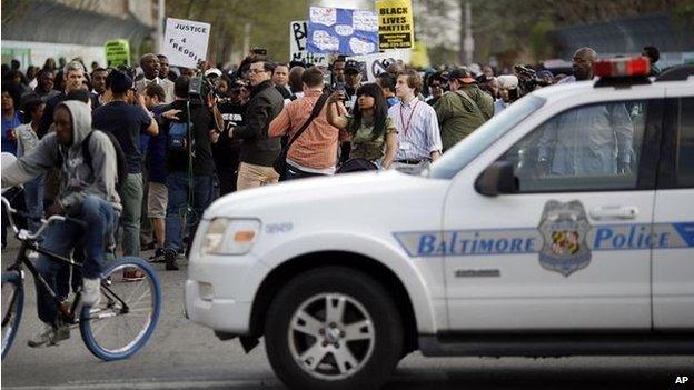 Protestors march after a rally for Freddie Gray