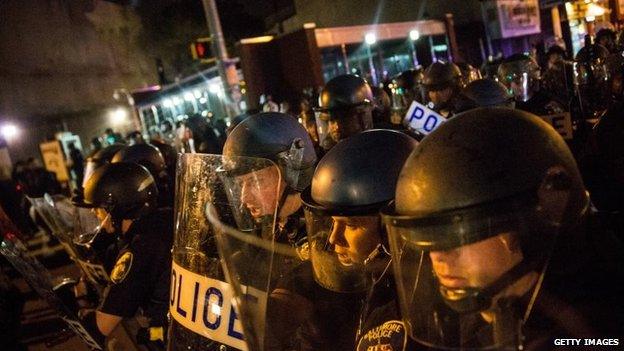 Riot police advance on protesters and media during protests in the Sandtown neighborhood where Freddie Gray was arrested on April 30, 2015