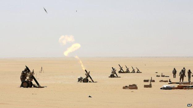 Saudi soldiers fire artillery towards the border with Yemen in Najran, Saudi Arabia