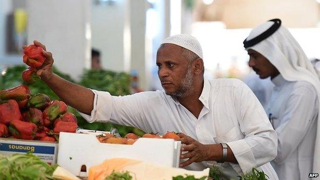 A Saudi vendor displays his products on a stall at a market