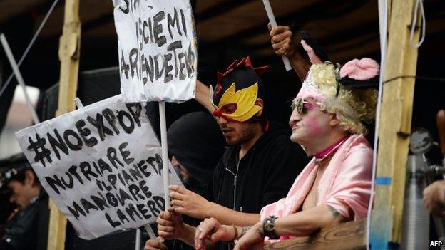 People holding sign reading "no Expo" demonstrate on 1 May 2015 in downtown Milan