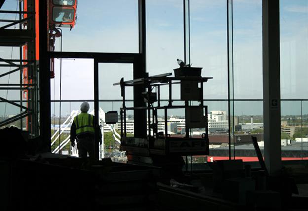 Builder looking through the window