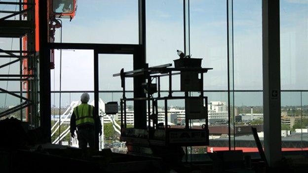 Builder looking through the window