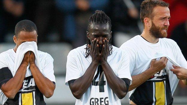 Emotional team-mates of Lokeren defender Gregory Mertens