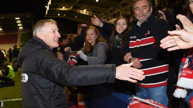 Edinburgh head coach Alan Solomons shakes hands with the travelling support at full-time