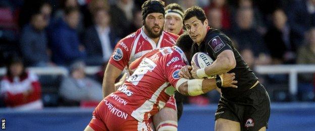 Edinburgh's Phil Burleigh (right) is tackled by John Afoa