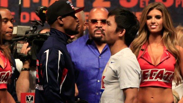 Mayweather and Pacquiao face each other after the weigh-in