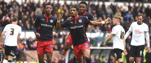 Reading's players celebrate their third goal against Derby