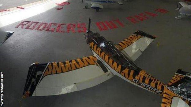 The plane carrying the 'Rodgers out' banner