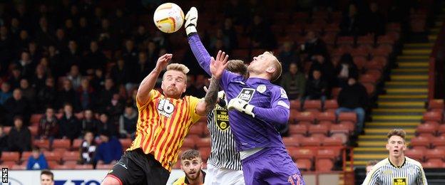 Partick Thistle's Ryan Stevenson challenges for the ball with Mark Ridgers