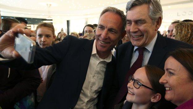 Jim Murphy and Gordon Brown take a selfie with supporters in Glasgow