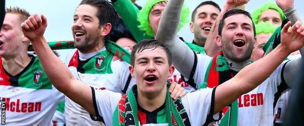 Jordan Stewart leads the celebrations after Glentoran's cup final victory over Portadown