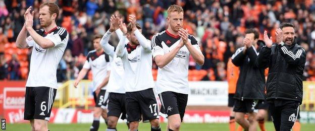 Aberdeen players and management applaud their fans