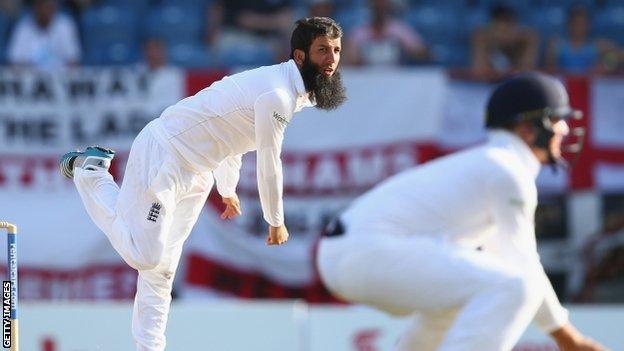 Moeen Ali bowls