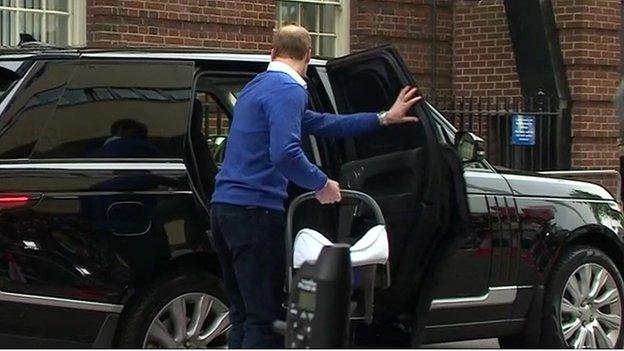 Prince William putting baby princess in car