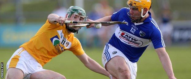 Charles Dwyer of Laois in action against Antrim's Paul Shiels during the Leinster Championship match