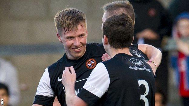 Jordan Moore celebrates with Dundee United