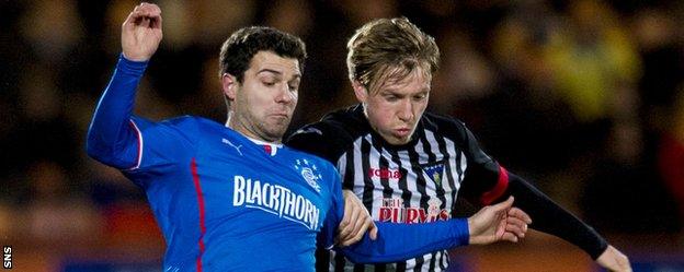 Rangers' Richard Foster competes with Jordan Moore while the latter was with Dunfermline