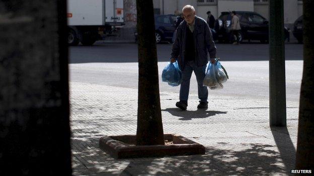 Man with shopping bags in Athens