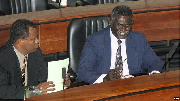 Prime Minister Manasseh Sogavare and a colleague in parliament