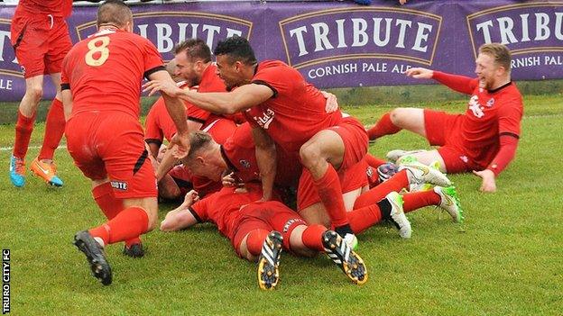 Truro City celebrate Shane White's winning penalty