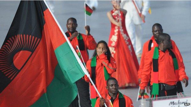 Athlete Charlton Nyirenda (C) Malawi's flag bearer parades in front of his delegation during the 2008 Beijing Olympic Games opening ceremony on 8 August 2008 at the National Stadium in Beijin