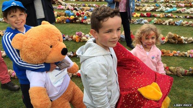 Finlay, Mackenzie and Tegan line up teddy bears