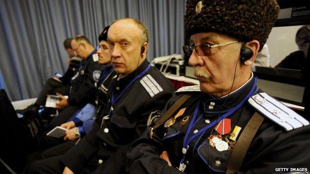 Uniformed men attending a conference