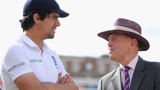 England captain Alastair Cook speaks with Geoffrey Boycott after drawing the first Test match against India at Trent Bridge on 13 July 2014