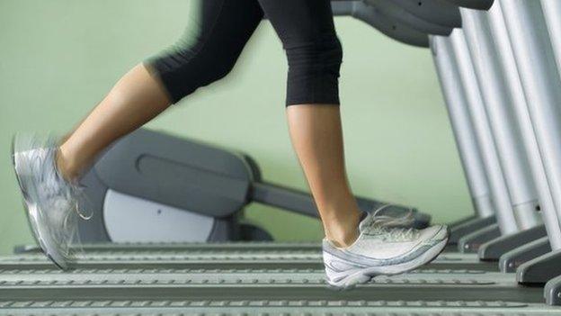 A woman running on a treadmill