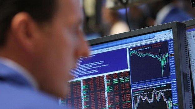 A Wall Street trader looks at his screen during the 'flash crash' on May 6 2010