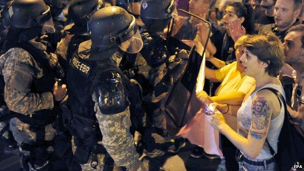 Protesters confront police outside government buildings in Skopje (5 May)