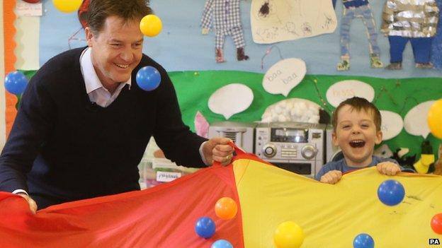 Nick Clegg and child playing with balls