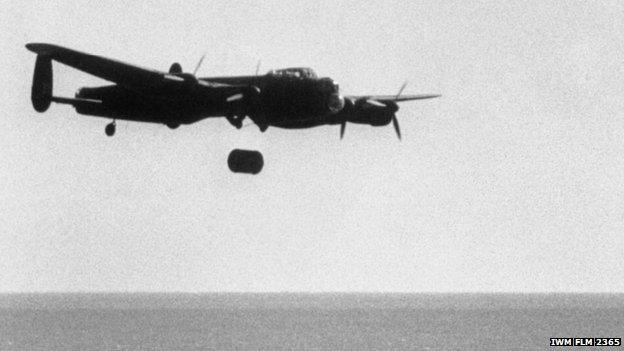 A "bouncing bomb" falls away from an Avro Lancaster during the tests