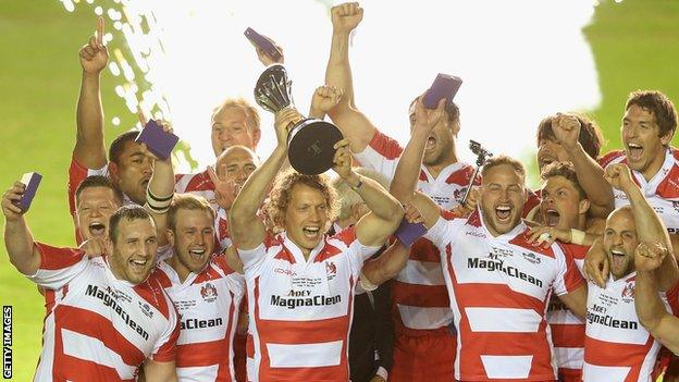 Gloucester players celebrate their European Challenge Cup final win against Edinburgh at the Twickenham Stoop